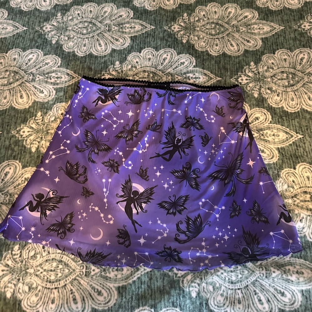 Check out this SUPER CUTE mini skirt!  It’s a size XL, but runs more like a an L